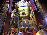 04-2 Maitreya In Tashilhunpo Here is another statue of Maitreya, the future Buddha, this one from Tashilhunpo in Shigatse. It is 26.2m high and contains 279kg of gold and 150,000kg of copper and brass molded on a wooden frame.